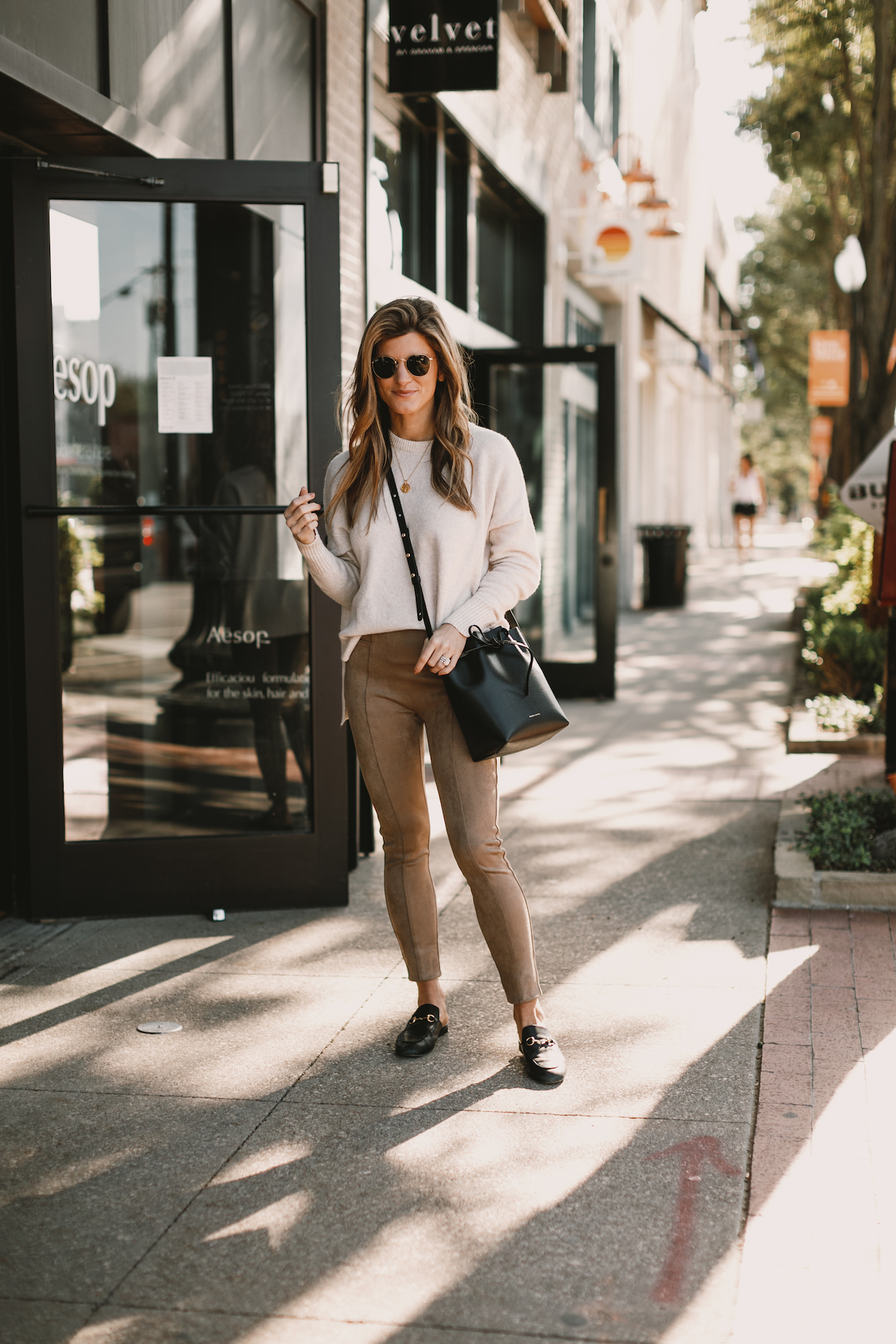 Brighton Butler wearing Spanx Suede Leggings with Sweater and Gucci Slides