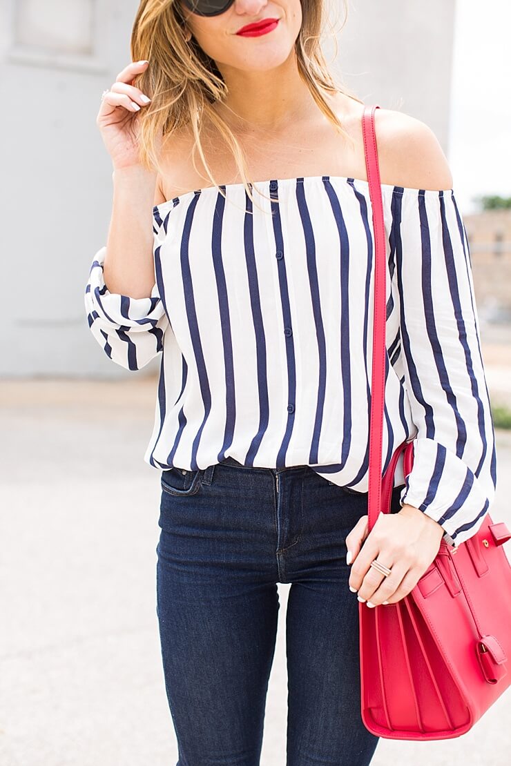 off the shoulder top + red bag + jeans 