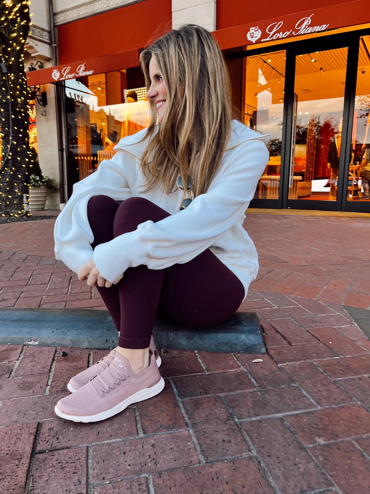 Brighton Butler wearing Varley pullover with maroon lulu aligns and APL's