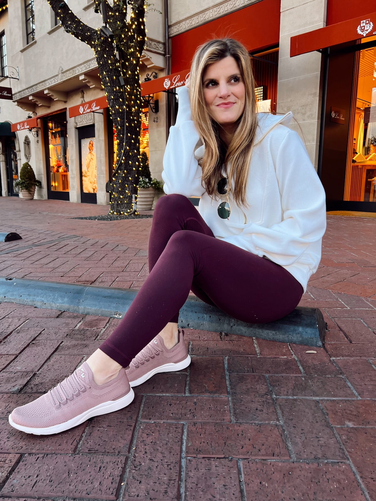 Brighton Butler wearing Varley pullover with maroon lulu aligns and APL's