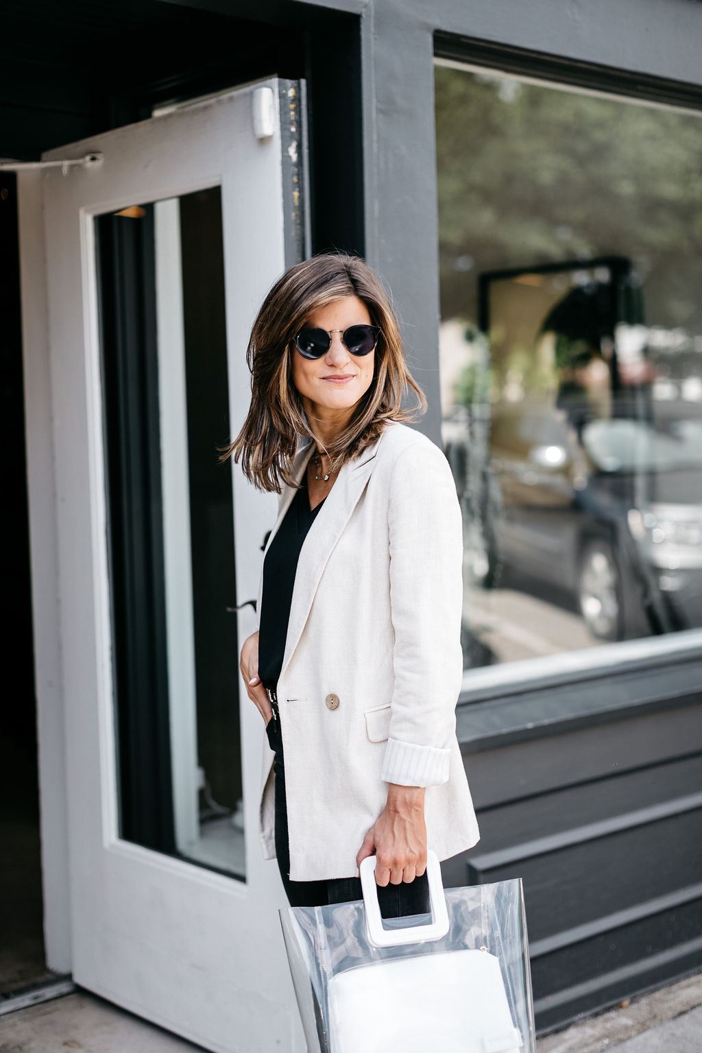 brighton keller wearing linen toyshop blazer and STAUD clear white bag