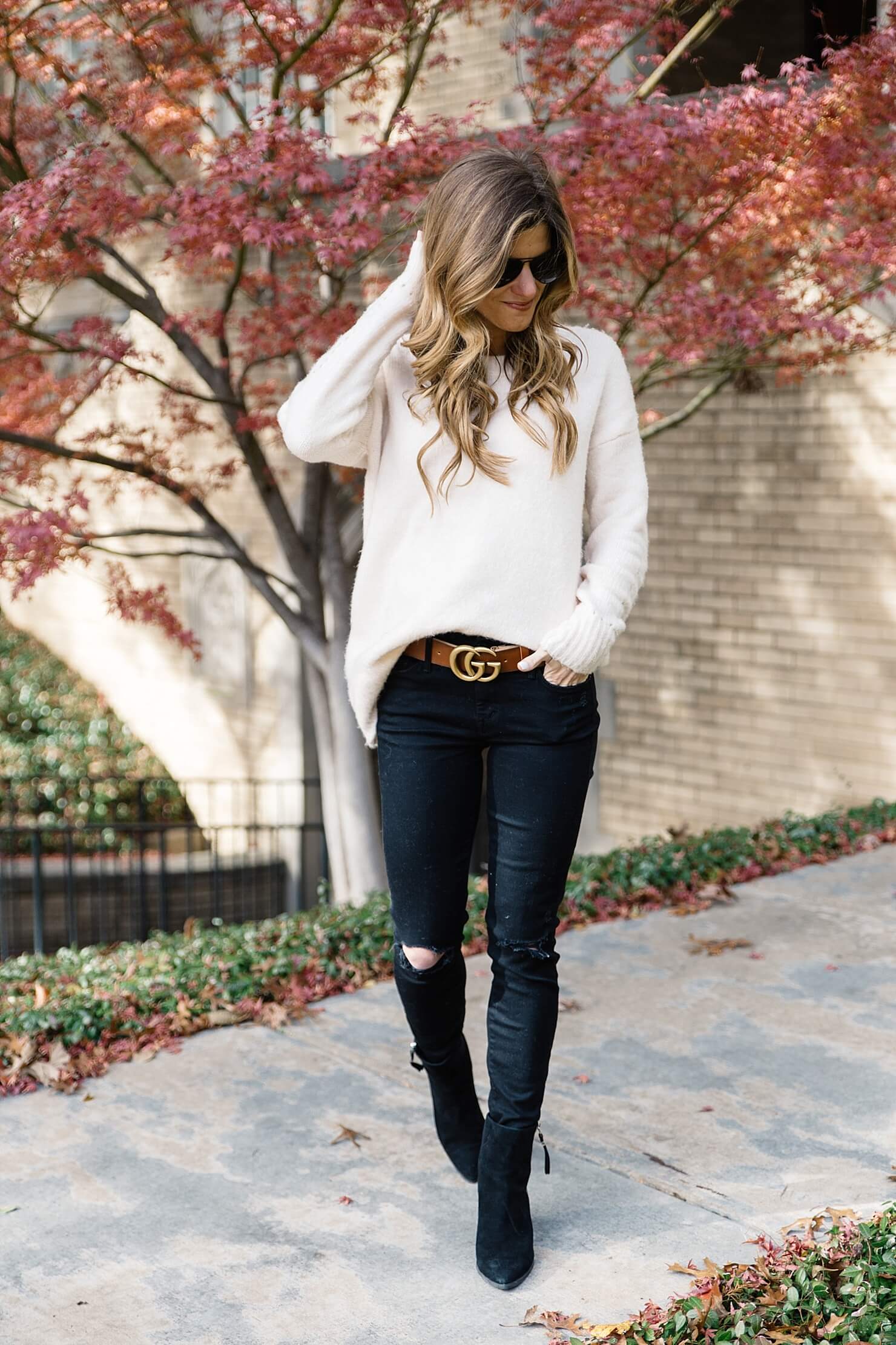 statement belt trend to try gucci brown logo belt, black jeans and black booties, brown belt with black jeans, oversized sweater with skinny jeans, casual fall outfit