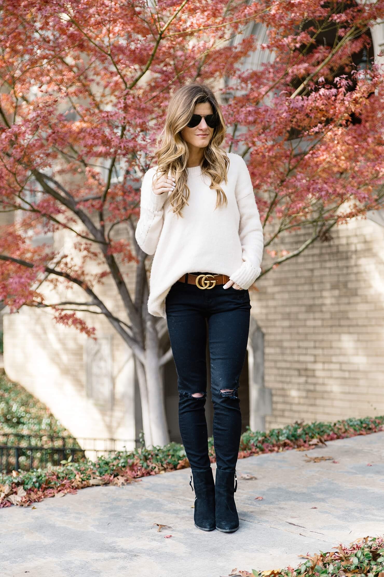 statement belt trend to try gucci brown logo belt, black jeans and black booties, brown belt with black jeans, oversized sweater with skinny jeans, casual fall outfit