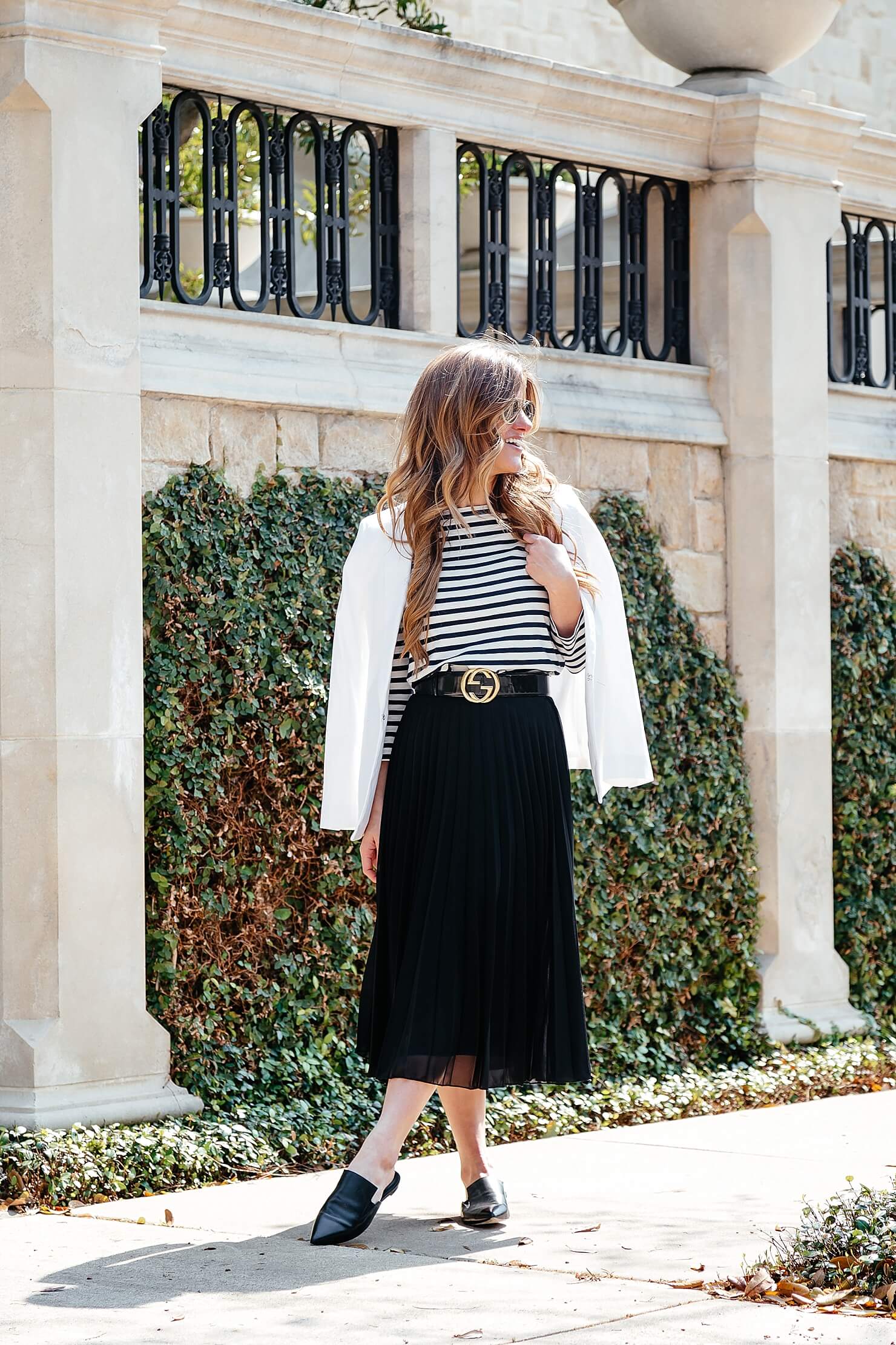 how to dress like a parisian, black and white outfit, black pleated midi skirt, striped tee, gucci belt, pointed toe flats