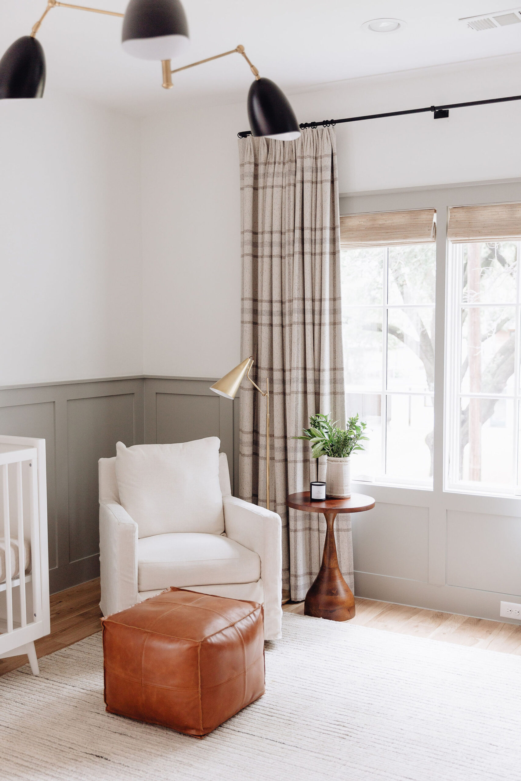 brighton butler nursery, green wainscoting, white crib, pottery barn chair, neutral rug