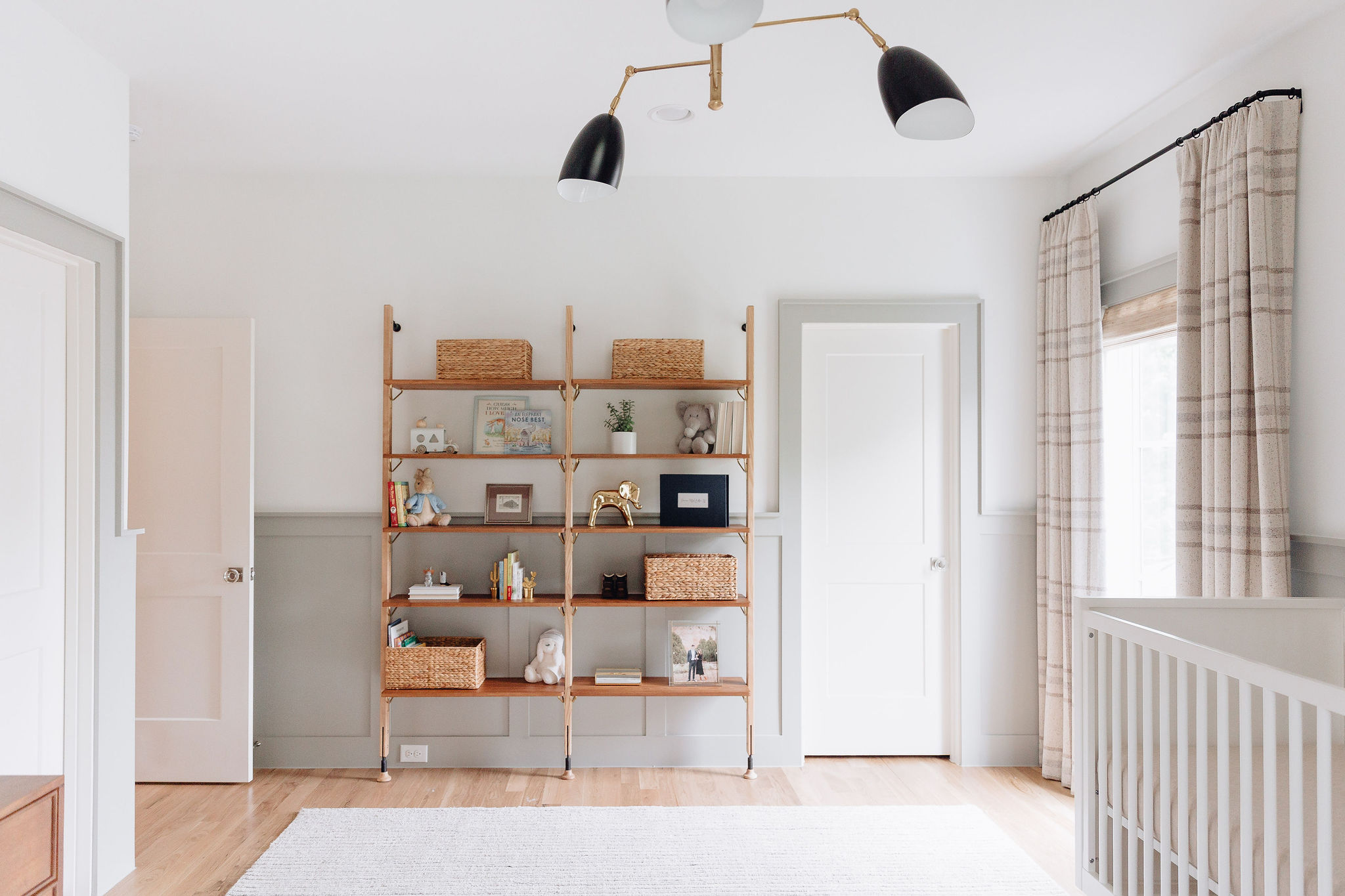 nursery bookshelves, green wainscoting, nursery