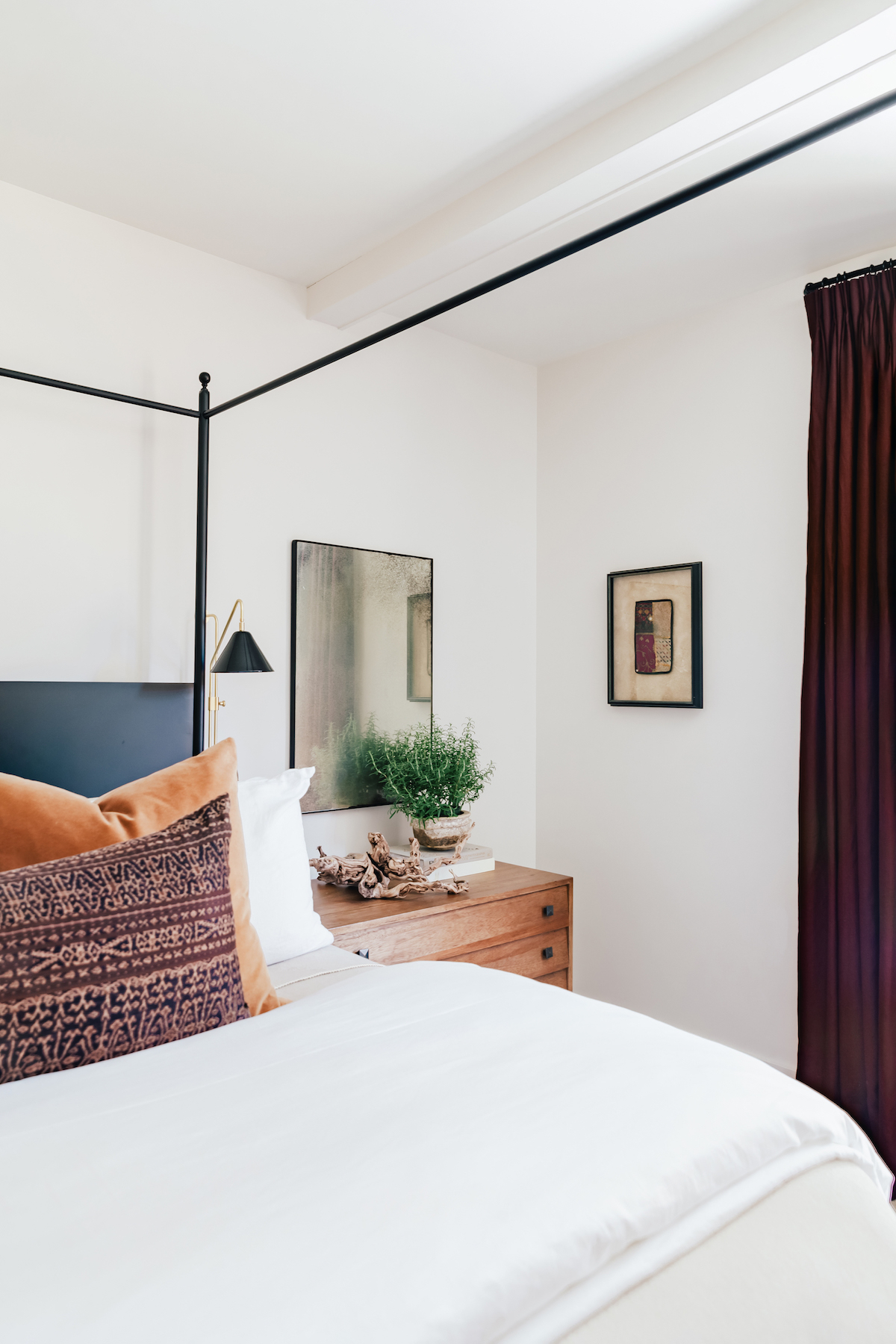 owner bedroom with black bed and neutral bedding, brighton butler bedroom