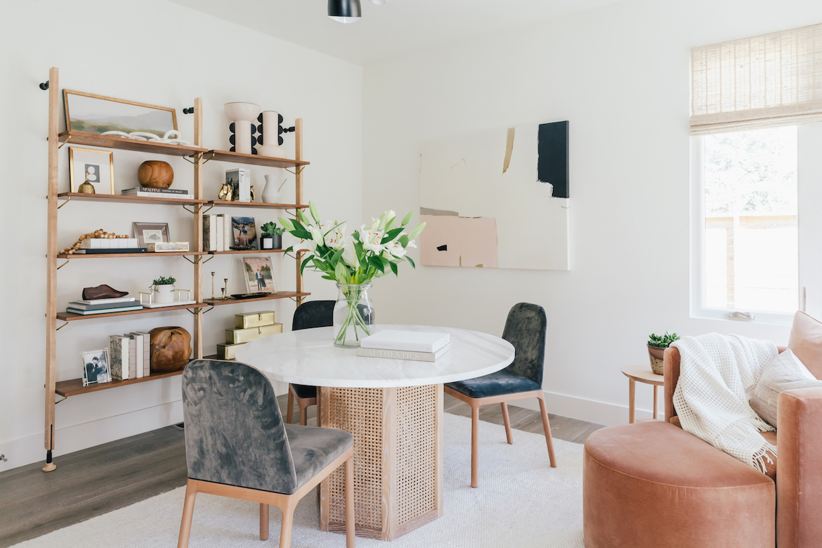 brighton butler denver office, white marble top round table, round table in office, grey velvet chairs, neutral rug, neutral office