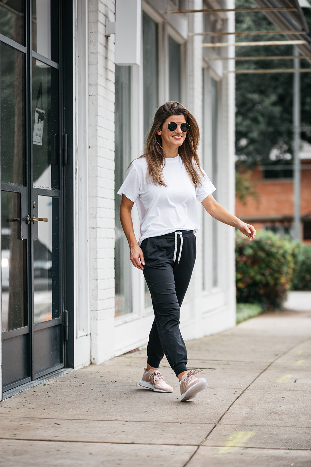 brighton butler wearing vuori jogges and lululemon all yours tee and adidas swift run sneakers