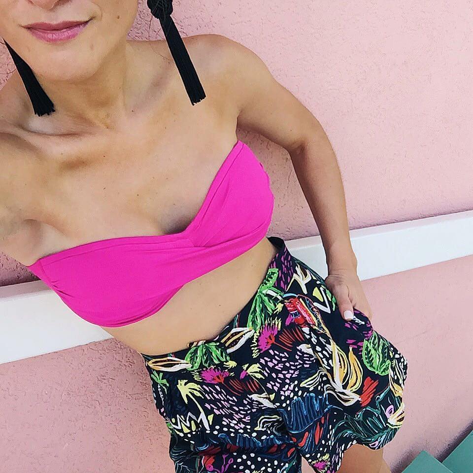 brightonkeller instagram hot pink bandeau with high-waisted printed shorts and black tassel earrings