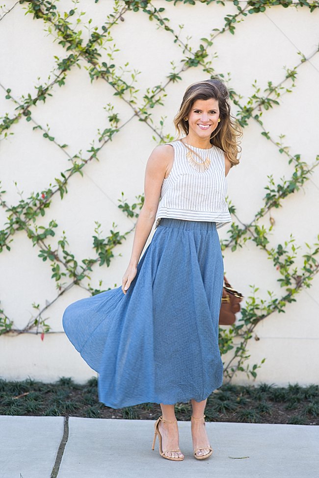 brightontheday wearing blue high-waisted midi skirt with stripe crop top, statement necklace and SW nudist heels