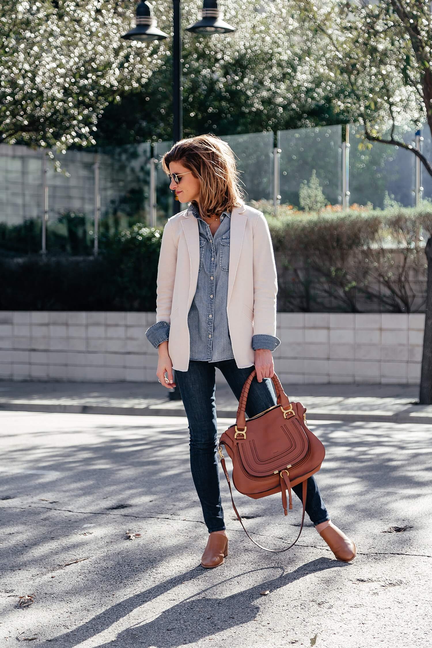 brighton keller wearing canadian tuxedo denim on denim outfit for spring