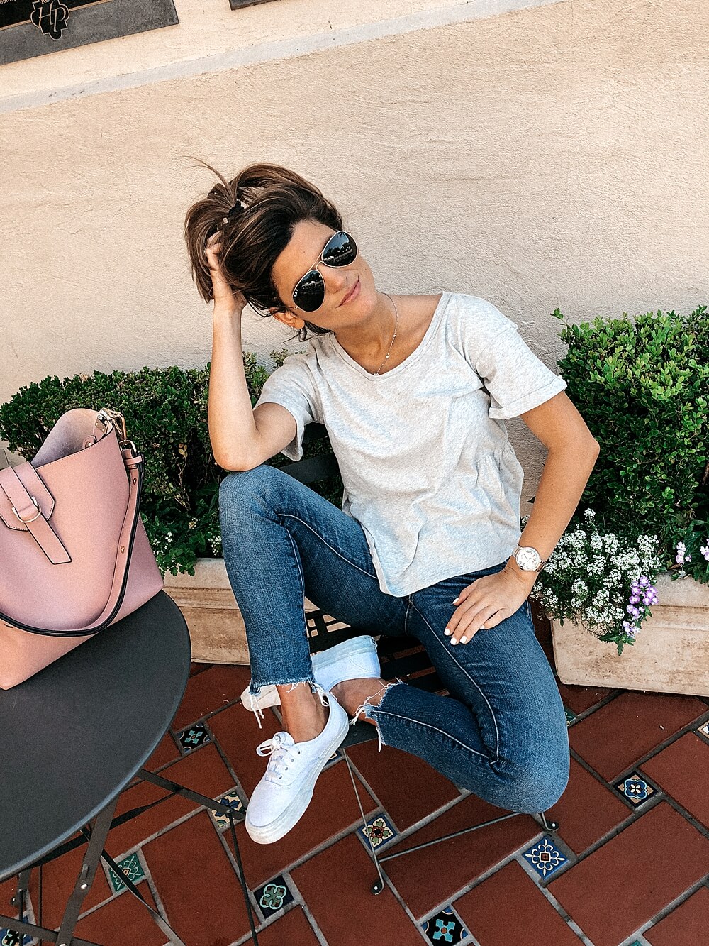 how to not care what others think brighton keller wearing blue jeans and grey tee with vans sneakers