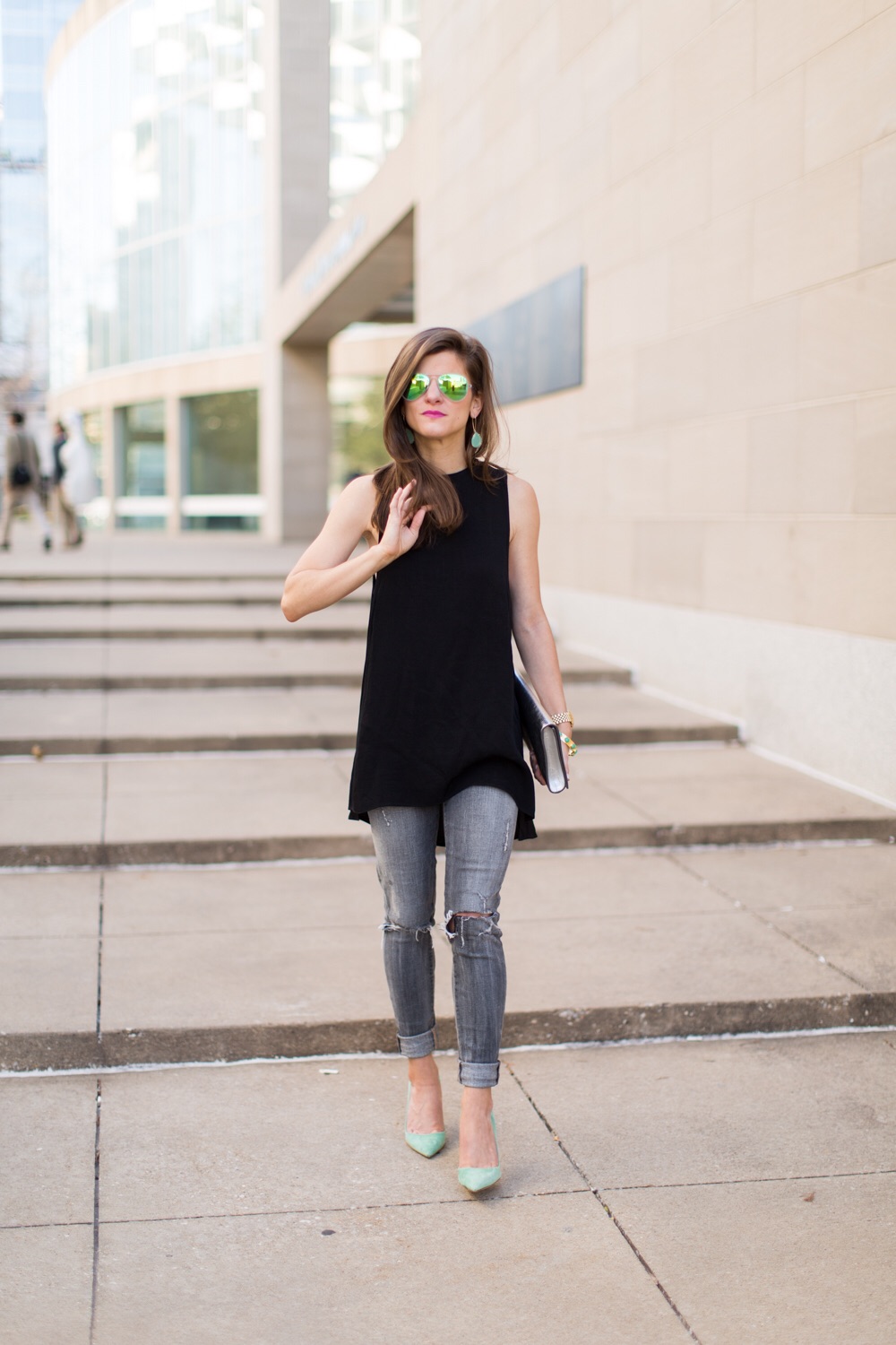 grey jeans + black tunic top + green suede shoes