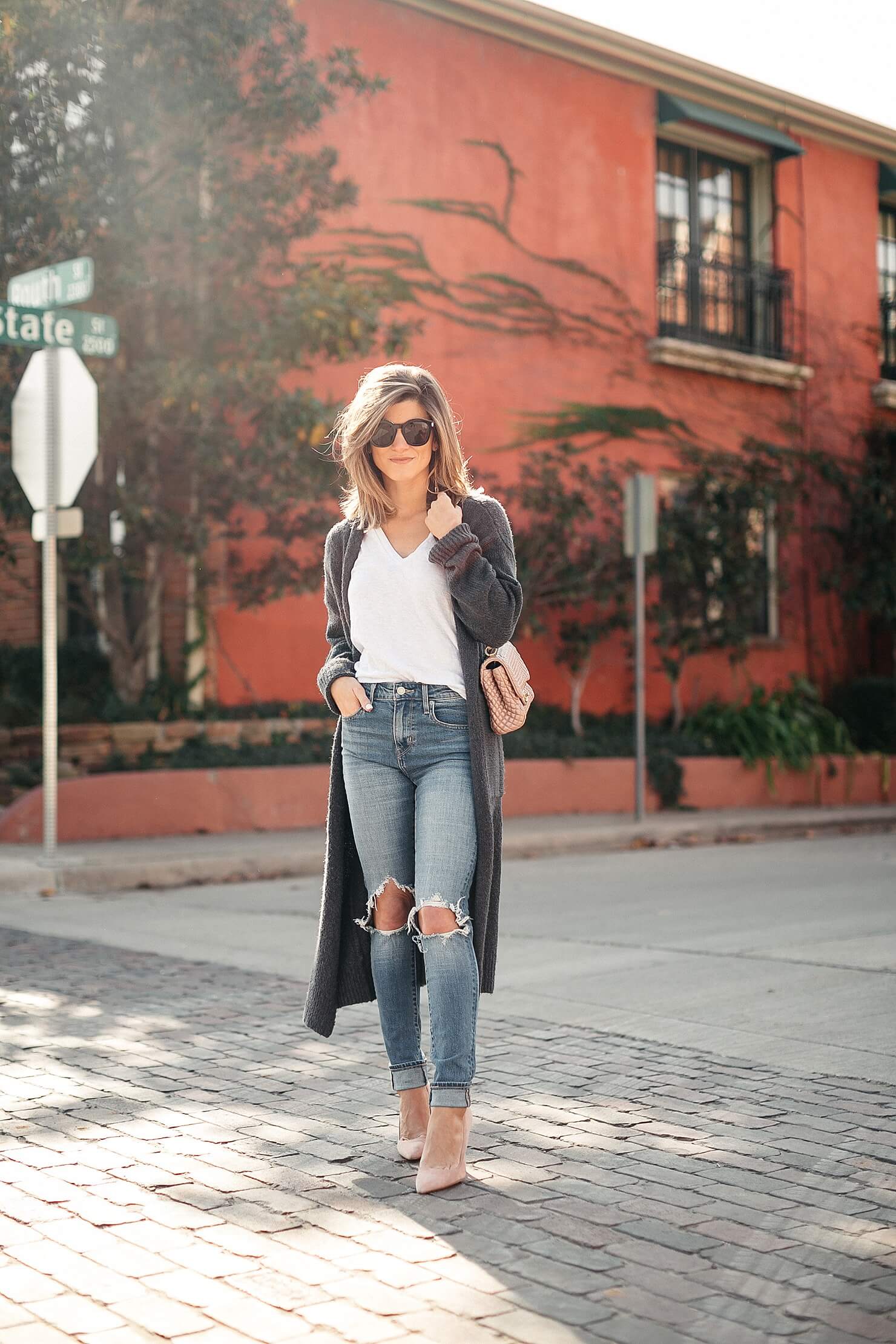 long grey duster outfit with white Monrow tee and Levi's high-rise 721 denim