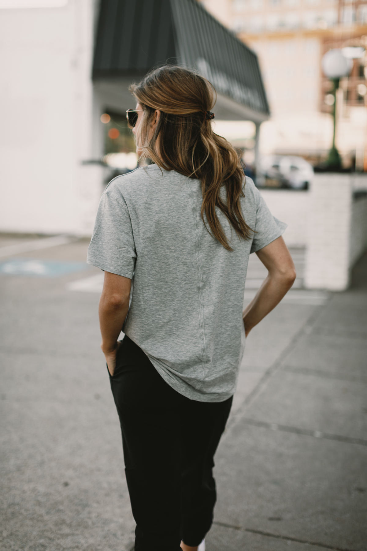 Brighton Butler wearing lululemon joggers with grey all yours tee and white adidas