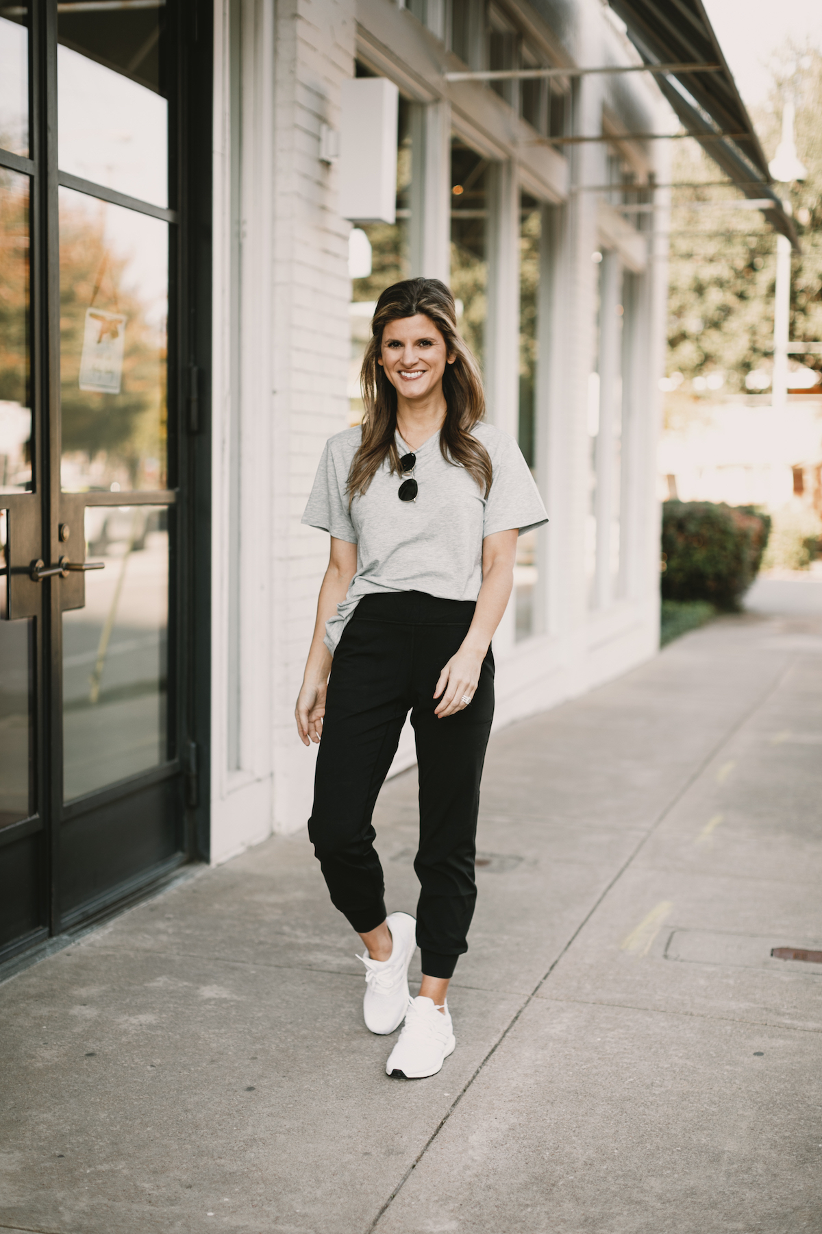 Brighton Butler wearing lululemon joggers with grey all yours tee and white adidas