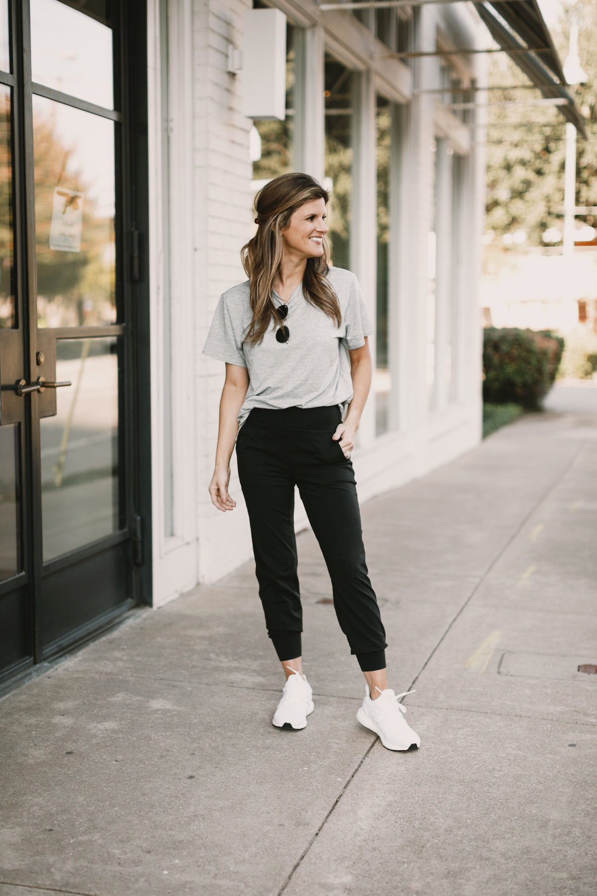 Brighton Butler wearing lululemon joggers with grey all yours tee and white adidas