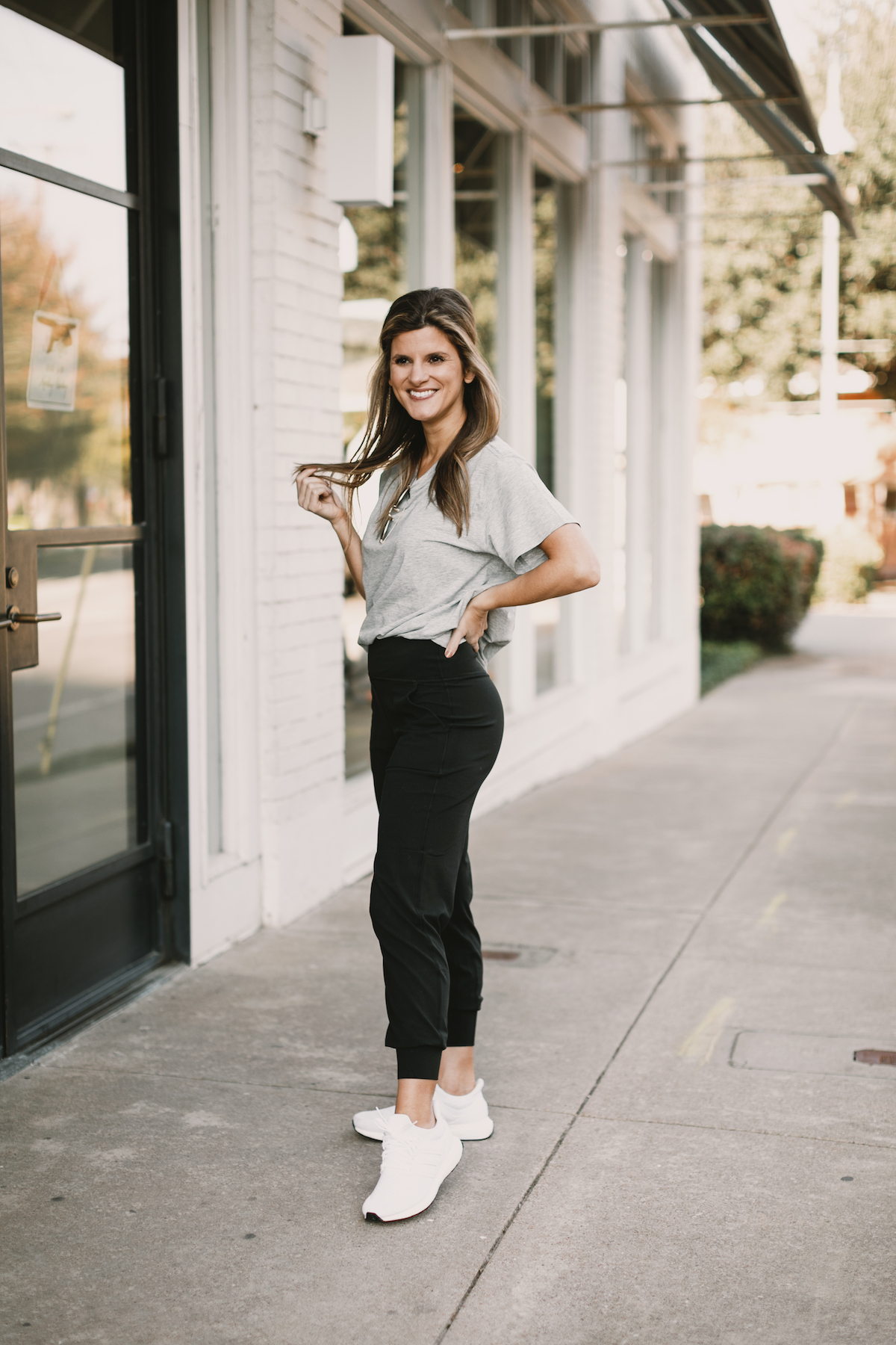 Brighton Butler wearing lululemon joggers with grey all yours tee and white adidas