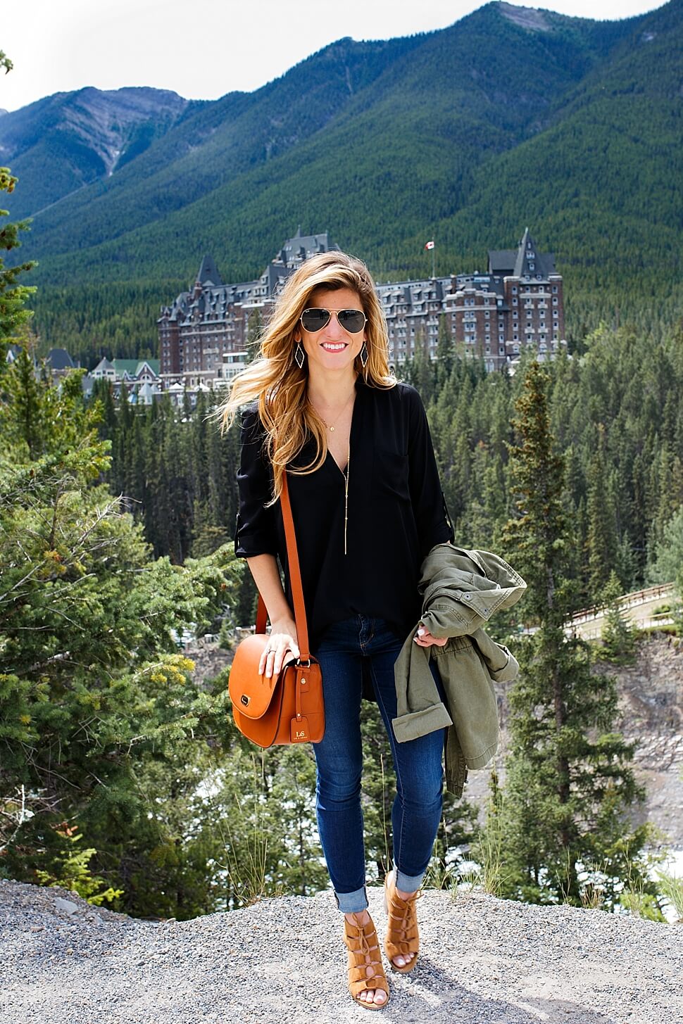 denim + utility jacket + black tunic + cognac bag 