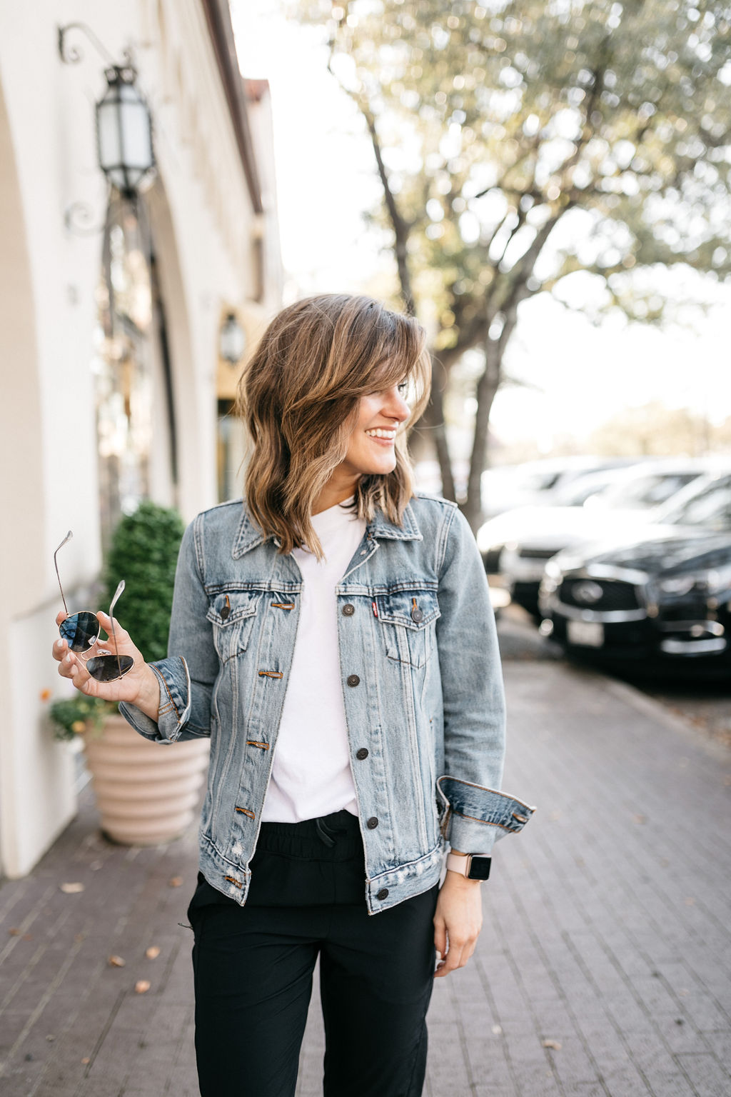 athleisure look black joggers white tee denim jacket 6