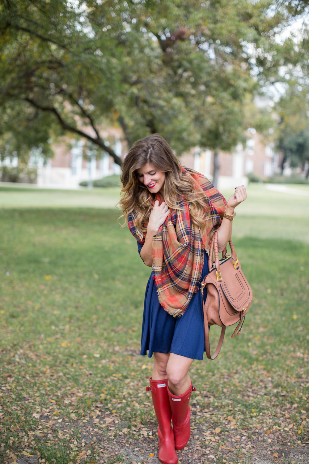 navy swing dress and blanket scarf and hunter boots rainy day outfit