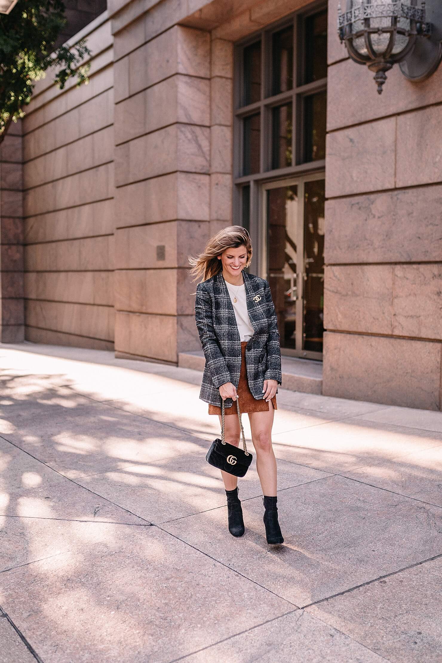 plaid blazer fall trend outfit with suede skirt and black booties