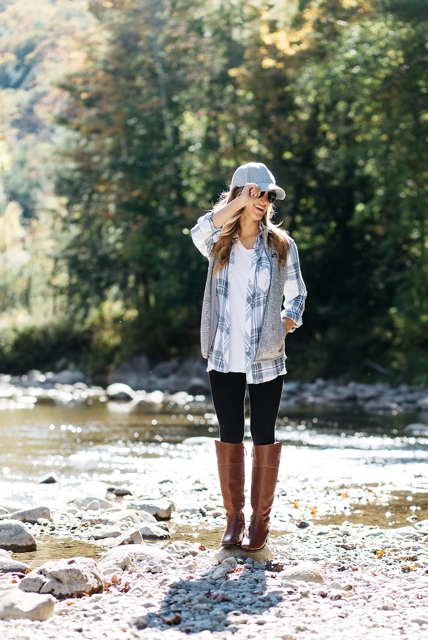 what to wear with leggings - fall outfit, leggings outfit with plaid shirt, tunic plaid shirt with leggings, tory burch junction riding boots, basebal cap, white hanes tee, comfy black leggings outfit for fall