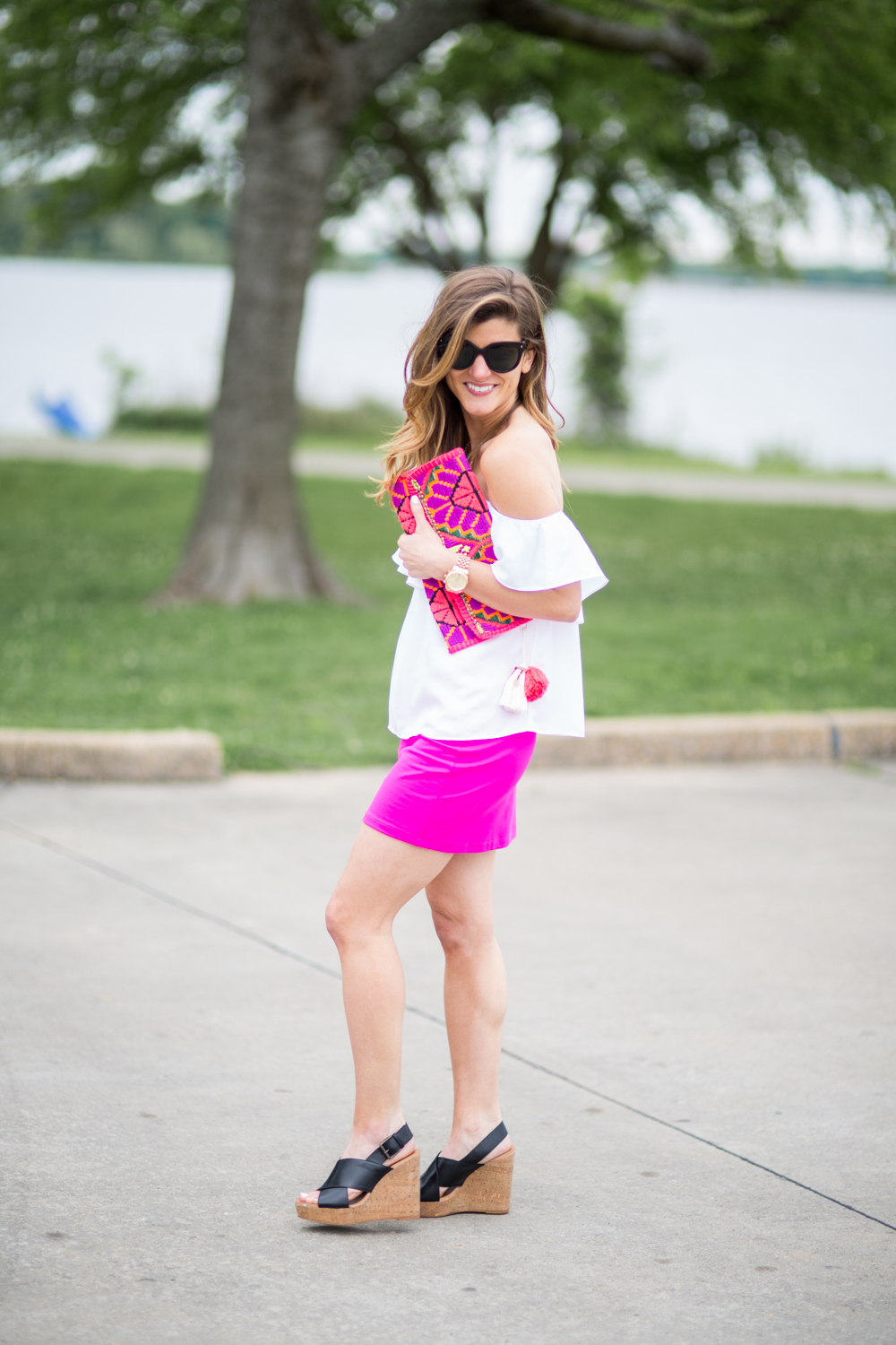 statement clutch and off the shoulder shirt