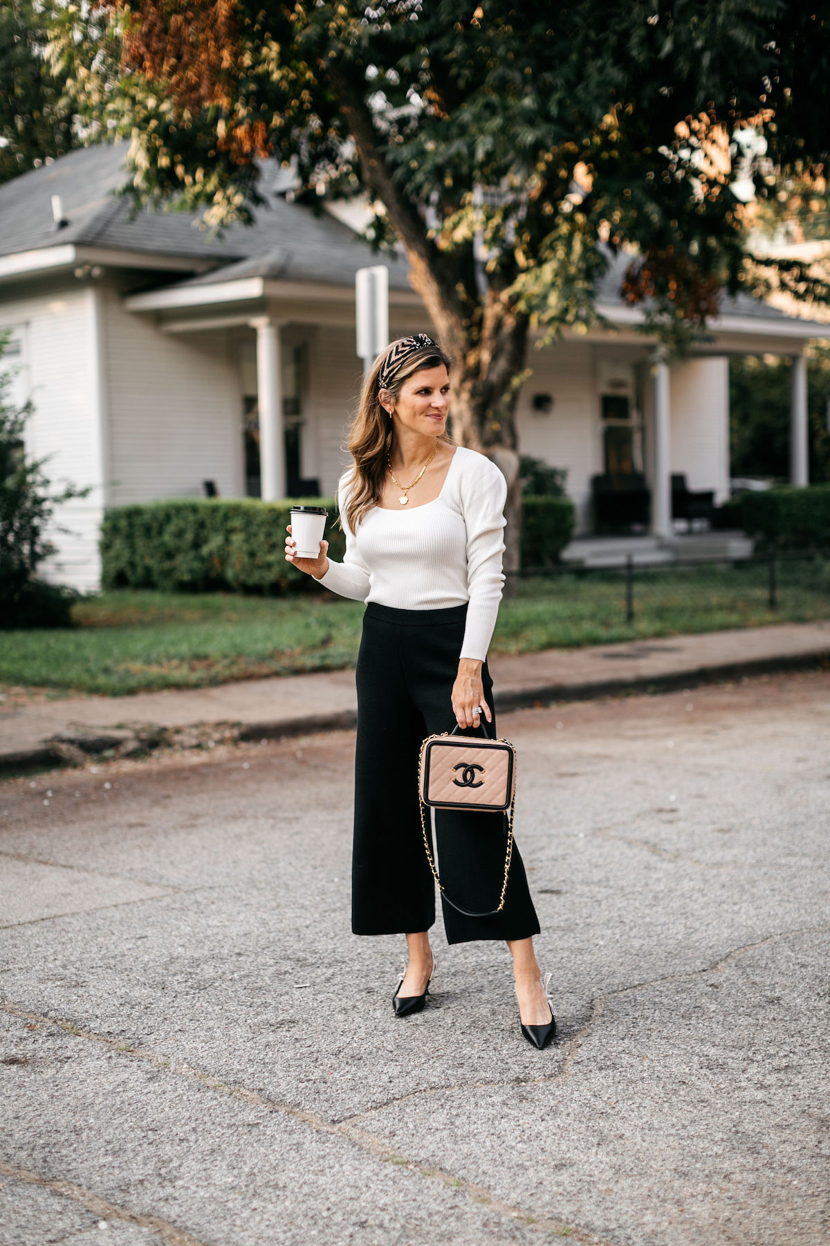 work outfit brighton butler wearing jcrew black pants and cream sweater businss casual 1a